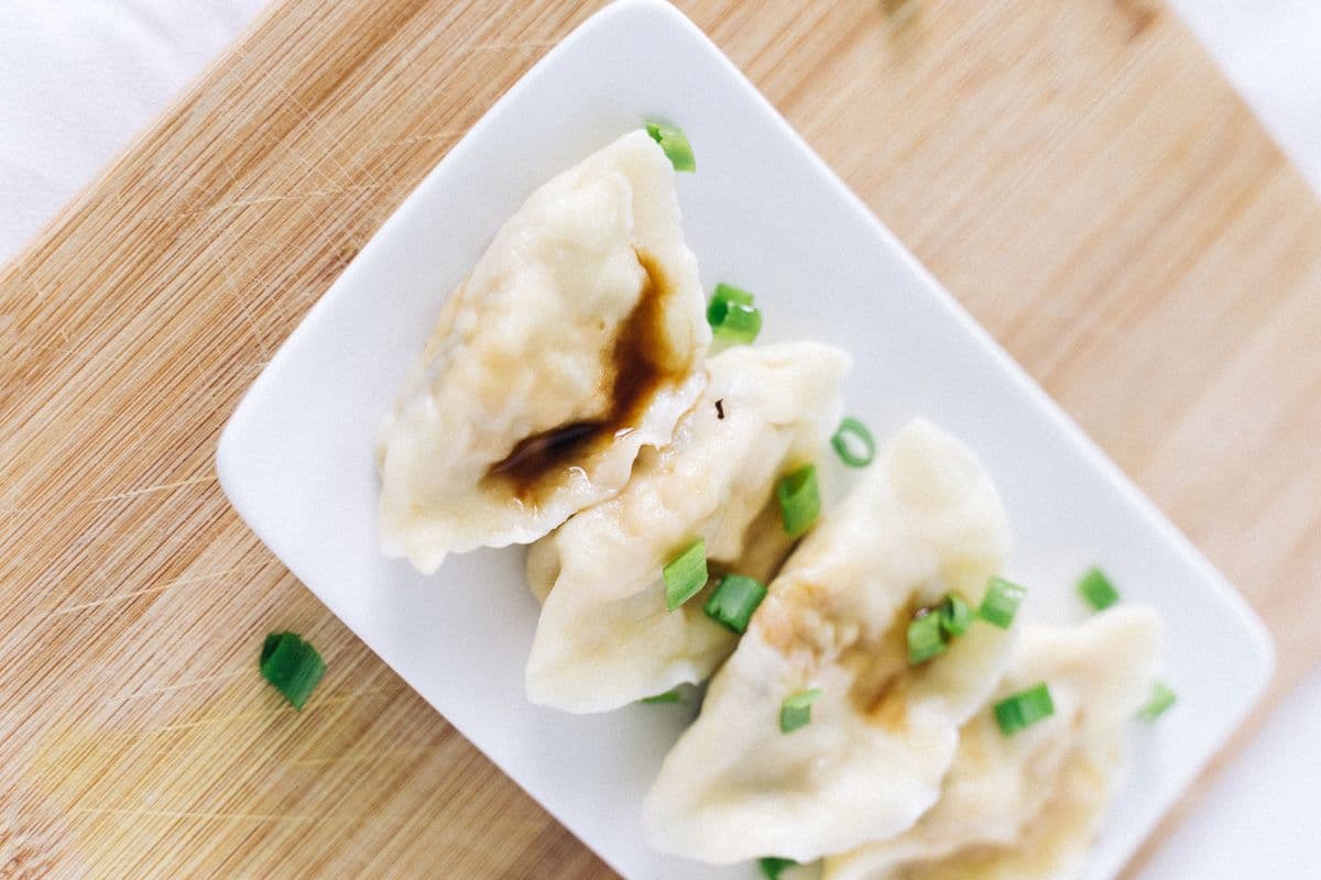 Chinese dumplings with soy sauce and scallions